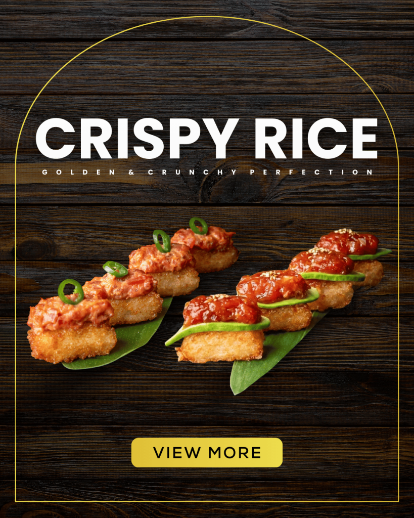 Sushi Zanmai Crispy Rice appetizer with spicy tuna and avocado toppings on a dark wood background.