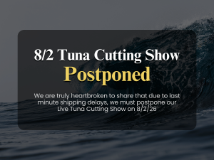 Text card notice announcing 8/2 Live Tuna Cutting Show Postponed due to last minute shipping delays against dark wave background.